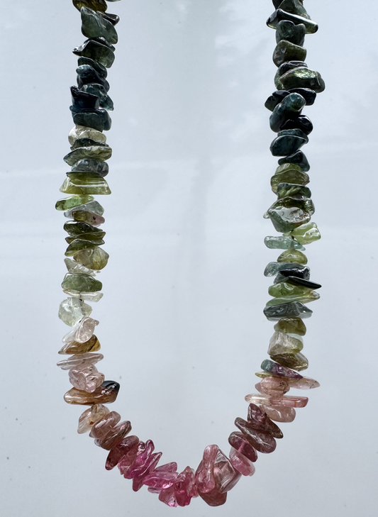 Necklace with multicolored gemstone chips on a white background